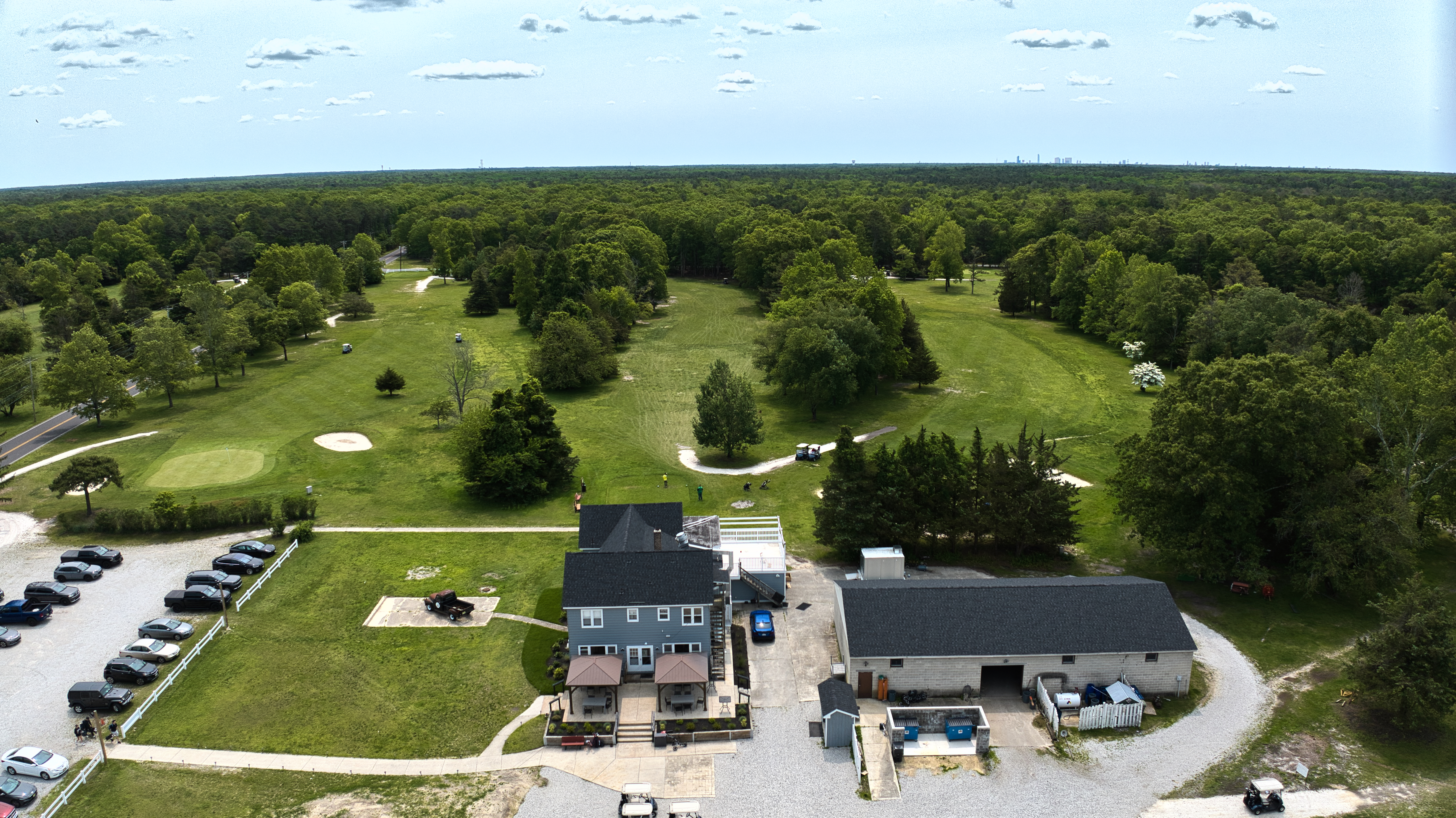 Image of golf ball on tee on grass.